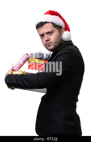 Foto von Ernst brunet in santa hut mit Kartons mit Geschenken in den Händen auf leeren weißen Hintergrund Stockfoto