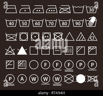 Satz von Waschmaschine Symbole (Icons) Wäscheservice auf dunklem Hintergrund Stockfoto