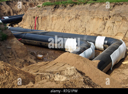 Die Bauarbeiten. Die Verlegung der Pipeline. Reparatur von Kommunikation Stockfoto