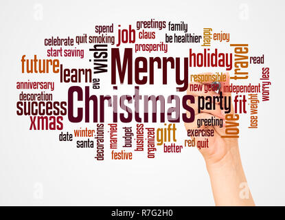 Frohe Weihnachten Wort cloud und Hand mit Marker Konzept auf weißem Hintergrund. Stockfoto