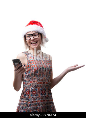 Bild des Blonden in Gläsern und Weihnachtsmann-mütze mit Telefon in der Hand auf leeren Raum Stockfoto