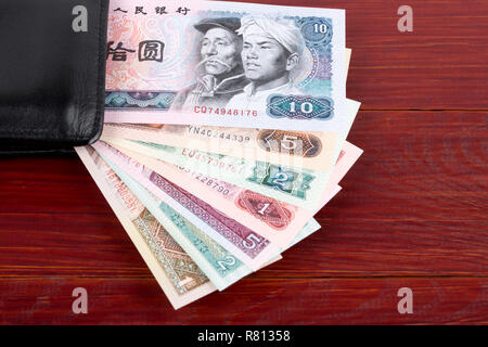 Alte chinesische Geld in der schwarzen Mappe Stockfoto