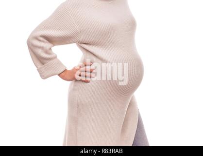 Abbildung einer schwangeren Frau in einem warmen Winter Pullover. Stockfoto