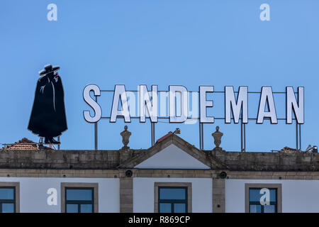 Gaia / Porto / Portugal - 10 01 2018: View of main façade of traditional Portuguese urban building on Gaia city with Porto Wine brand on roof top Stockfoto