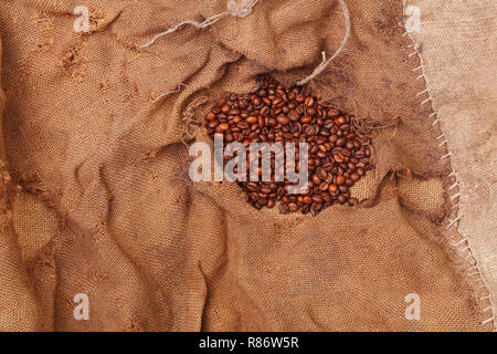 Hintergrund mit Textur von Sackleinen, Kaffeebohnen Stockfoto