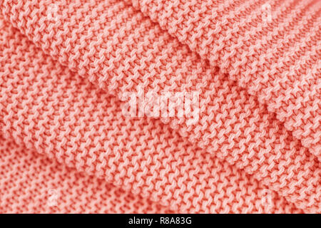 Gestrickte Textur in Coral Farbe. Close Up. Stockfoto