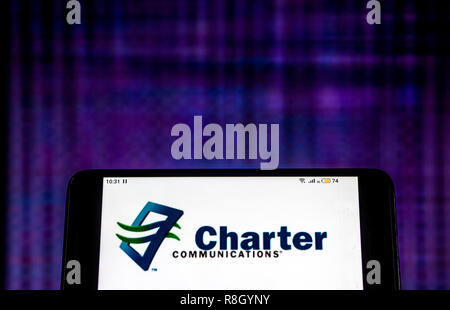 Charter Communications Telecommunications Company Logo auf dem Smartphone angezeigt. Stockfoto