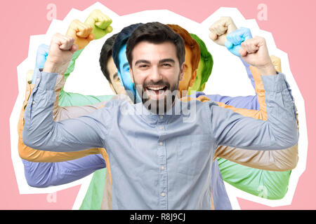 Portrait von Happy spanischer Mann mit den Fäusten auf seinen Sieg feiern. Stockfoto