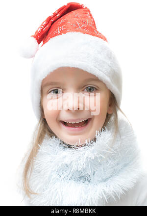 Ein bezauberndes, kleines Mädchen, das Tragen eines Santa Claus Hut, mit einem glücklichen Lachen Ausdruck. Stockfoto