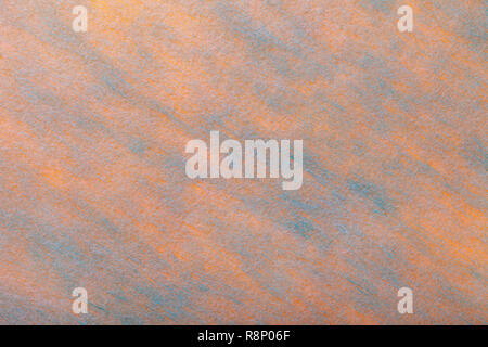 Struktur eines leichten Coral Hintergrund mit blauen Flecken aus Filz, Stoff, Nahaufnahme. Textur der Kammgarn orange matt Textil. Tuch Kulisse. Stockfoto