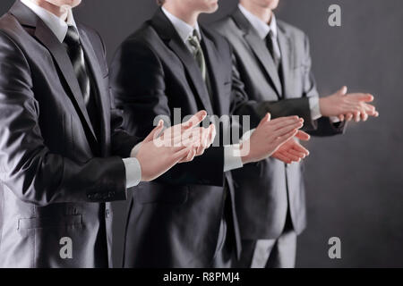 Business Group stehen in einer Reihe und applaudieren Stockfoto