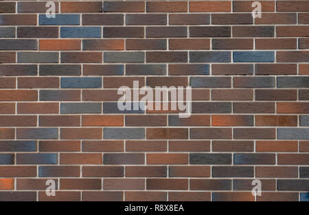 Bunte Mauer Fassade (Textur Hintergrund) nützlich, unebenen Stein Oberfläche für Hintergrund vintage Bau. Stockfoto