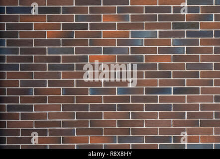 Bunte Mauer Fassade (Textur Hintergrund) nützlich, unebenen Stein Oberfläche für Hintergrund vintage Bau. Stockfoto