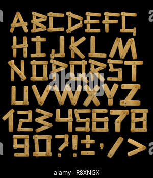 Alphabet - Briefe von Brettern mit Nieten. Objekte, die über Schwarz Stockfoto