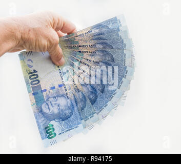 Südafrikanische Banknoten in die Hand. Stockfoto