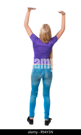 Zurück Blick auf Frau drückt Wand. Auf weissem Hintergrund. Ansicht von hinten leute Sammlung. Rückseite Ansehen der Person. Langhaarige Blondine im Purple Stockfoto