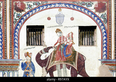 Ein Prinz und seine Frau auf einem Kamel an der Wand von Dr. Ramnath an Podar Haveli in Nawalgarh Shekhawati, Rajasthan, Indien gemalt Stockfoto