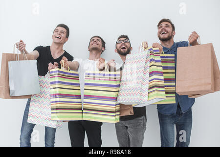 Gruppe der glückliche junge Freunde mit Einkaufstüten. Stockfoto