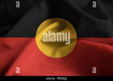 Nahaufnahme von gekräuselten Australian Aboriginal Flagge Aborigines Flagge weht im Wind Stockfoto