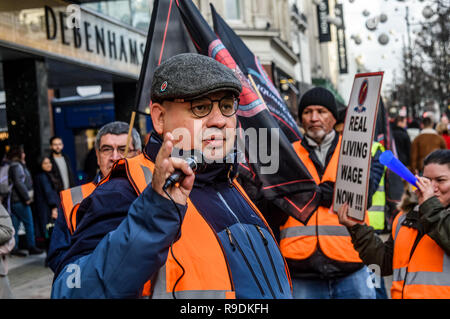 London, Großbritannien. 22. Dezember 2018. Reiniger auf der Oxford Street Zweig der Debenhams halten eine Kundgebung vor dem Store, wo Sie heute sind. Die unabhängige Gewerkschaft. 22 Dez, 2018. CAIWU eingetreten waren für die London Living Wage seit Mai, aber die Arbeitgeber Interserve haben keine Gespräche mit der Union, die sie zu erkennen verweigern verweigert. Peter Marshall/BILDER LIVE Credit: Peter Marschall/IMAGESLIVE/ZUMA Draht/Alamy leben Nachrichten Stockfoto