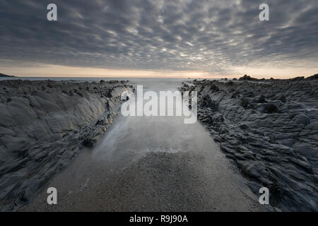 Welcombe Strand; Sonnenuntergang; Devon, Großbritannien Stockfoto