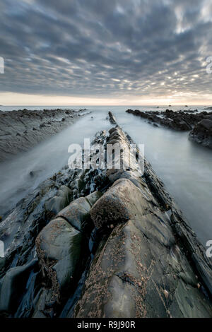 Welcombe Strand; Sonnenuntergang; Devon, Großbritannien Stockfoto