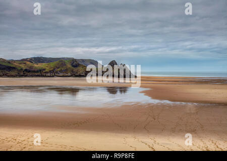 Reflections of Three Cliffs Bay Stockfoto