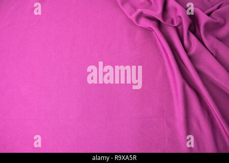 Rosa stoffgemustert Hintergrund. Sport rosa Bekleidung Stoff Jersey texturiert. Stockfoto