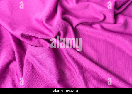 Rosa stoffgemustert Hintergrund. Sport rosa Bekleidung Stoff Jersey texturiert. Stockfoto