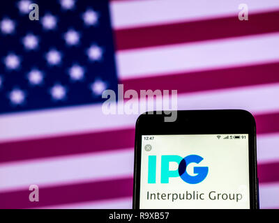 Interpublic Group Werbung Firmenlogo auf dem Smartphone angezeigt Stockfoto