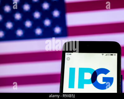 Interpublic Group Werbung Firmenlogo auf dem Smartphone angezeigt Stockfoto