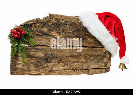 Weihnachten Vorlage - alte Holzschild mit Weihnachtsmütze und Zweig auf weißem Hintergrund Fichte Stockfoto