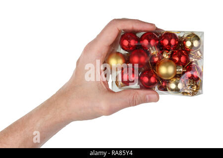 Großvater hält in seiner Hand Plastikdose mit Weihnachtskugeln. Auf weissem Studio cliseup Isoliert Stockfoto