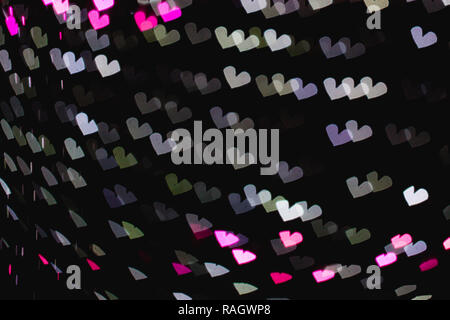 Das Bokeh des Herzens Form aus dem schönen bunten Licht Deco Stockfoto