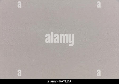 Hellgrau, bemalte Wand Textur Hintergrund. Äußere Fassade eines Wohnhauses Stockfoto