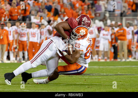 Santa Clara, Kalifornien, USA. 7 Jan, 2019. Januar 07, 2019 - Santa Clara, Kalifornien, USA - Alabama Crimson Tide defensive lineman Quinnen Williams (92) packt Clemson Tiger zurück laufen Adam (26) in den College Football Endspiel nationale Meisterschaft Spiel zwischen der Clemson Tiger und die Alabama Crimson Tide am Levi's Stadion, Santa Clara, Kalifornien. Quelle: Adam Lacy/ZUMA Draht/Alamy leben Nachrichten Stockfoto