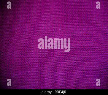 Purple Pink magenta Strickmuster Wollpullover Textur hautnah. Handgefertigte lila Stricken wolle Textur Hintergrund Stockfoto