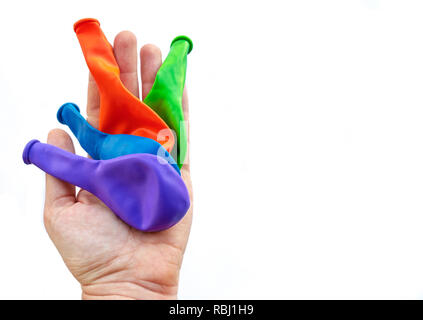 Deflationiert Luftballons werfen Partei isoliert Hintergrund Hand weiß Stockfoto