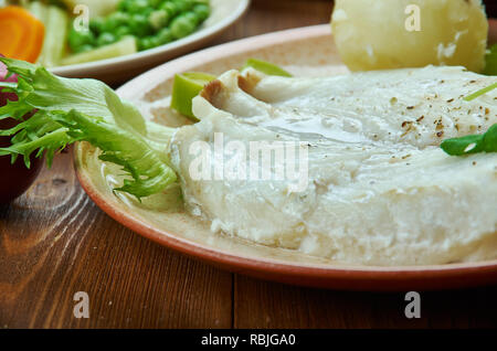 Lutefisk, traditionelles Gericht von einigen nordischen Ländern, norwegische Küche, Traditionelle verschiedene Gerichte, Ansicht von oben. Stockfoto