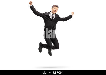 In voller Länge Porträt eines eleganten jungen Mann im Anzug auf weißem Hintergrund springen Stockfoto