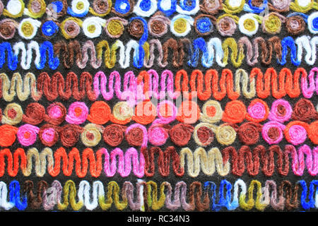 Farbiges Gestrick Hintergrund Textur, bunter Stoff mit einem Muster, Mat, mehrfarbige Leinwand, Textur von Sackleinen, Abstract, Fragment c Stockfoto