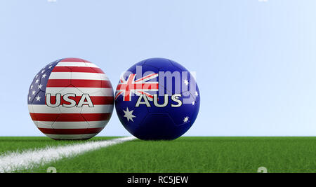 USA gegen Australien Fußball Match - Fußball-Kugeln in USA und Australien nationalen Farben auf einem Fußballfeld. Kopieren Sie Platz auf der rechten Seite - 3D-Rendering Stockfoto