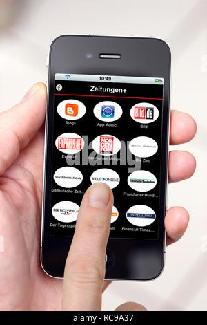 Iphone, Smartphone, App auf dem Bildschirm, eine virtuelle Zeitungskiosk Stockfoto