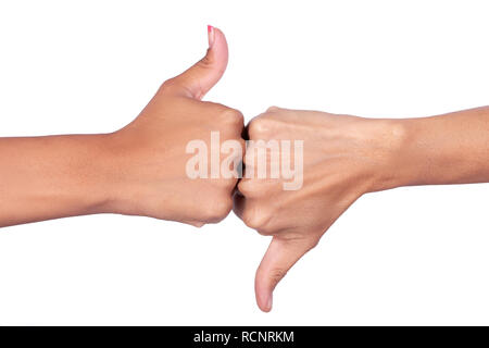 Weibliche Hände, die Signale mit dem Daumen der einen Hand nach oben und mit der anderen Hand nach unten Stockfoto