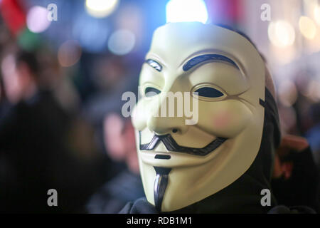 Anonyme Demonstranten protestieren in London Stockfoto