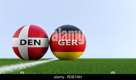 Deutschland gegen Dänemark Fußball Match - Fußball in Deutschland und Dänemark nationalen Farben auf einem Fußballfeld. Kopieren Sie Platz auf der rechten Seite - 3D-Rendering Stockfoto