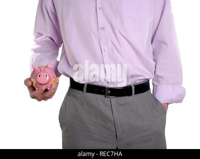 Man schaukelnd Sparschwein in der Hand, konzeptionelle Schuß Stockfoto