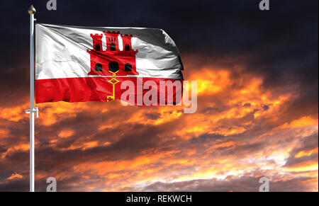 Flagge Gibraltar am Fahnenmast im Wind flattern gegen einen farbenprächtigen Sonnenuntergang Himmel. Stockfoto