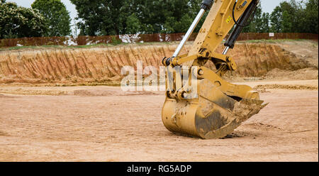 Eine Nahaufnahme Foto der Löffel am Bagger auf einer Baustelle. Stockfoto