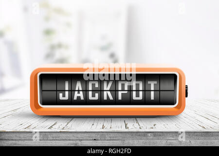 Jackpot Nachricht auf einem retro Alarm in einem hellen Raum auf einer hölzernen Schreibtisch Stockfoto